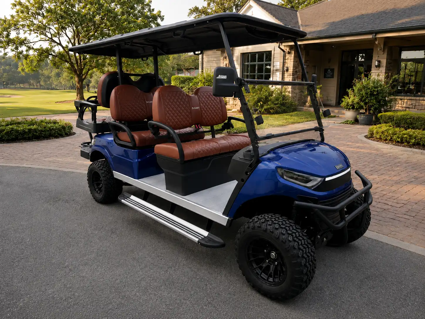 Blue lifted G-CART with tan quilted seats parked outside an estate clubhouse